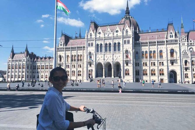 Budapest Highlights Bike Tour with a local guide - The Hungarian State Opera House stop: ornament, acoustics, and old transit