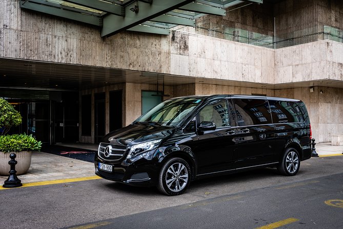 Budapest Private Airport Transfer in a Luxury Minivan - Inside the ride: luxury comfort, luggage help, and cold water